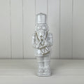 Glazed Ceramic Nutcracker Ornament With Textured Detail