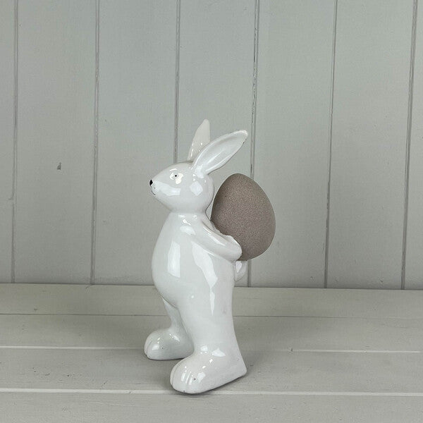 Ceramic White Rabbit holding an Egg