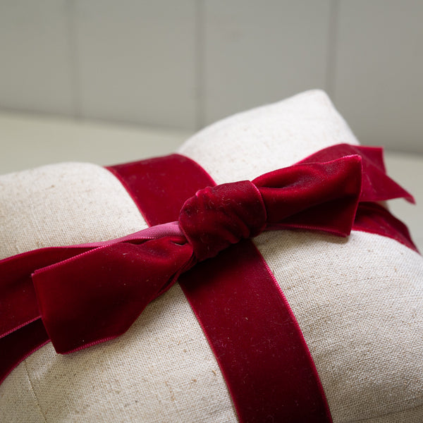 Natural Christmas Present with Red Velvet Bow Doorstop
