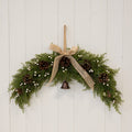 Arc Swag with White Berries, Pinecones with Bells and Bow Detail